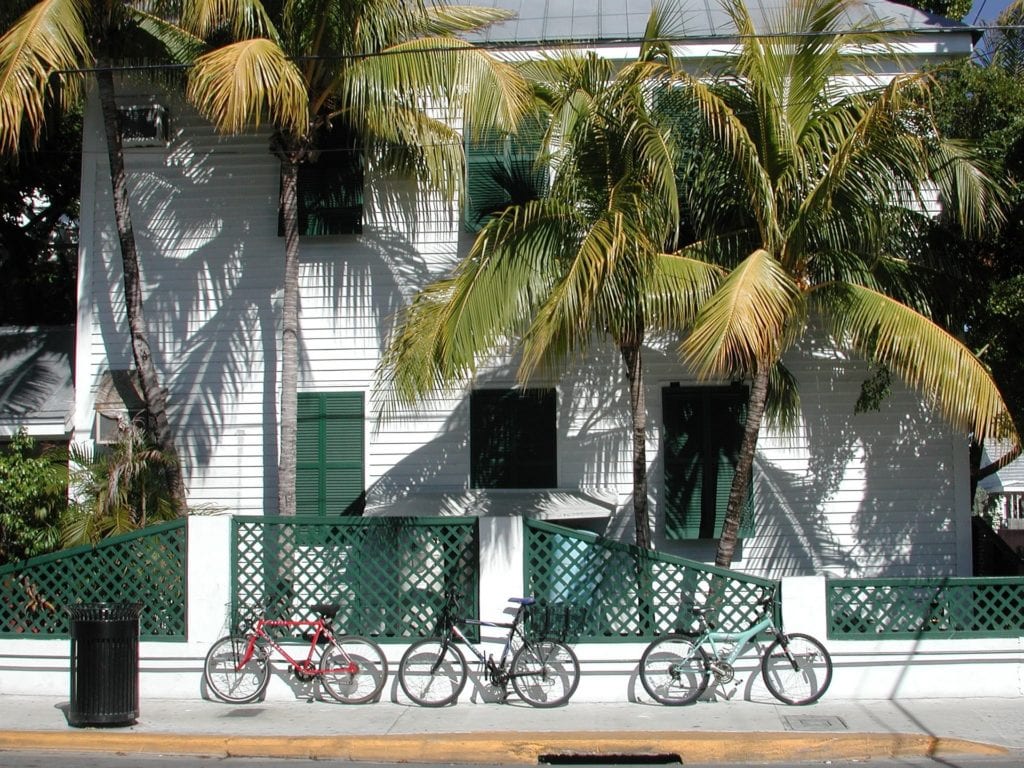 A typical house in Key West, with wooden siding and shuttered windows.
